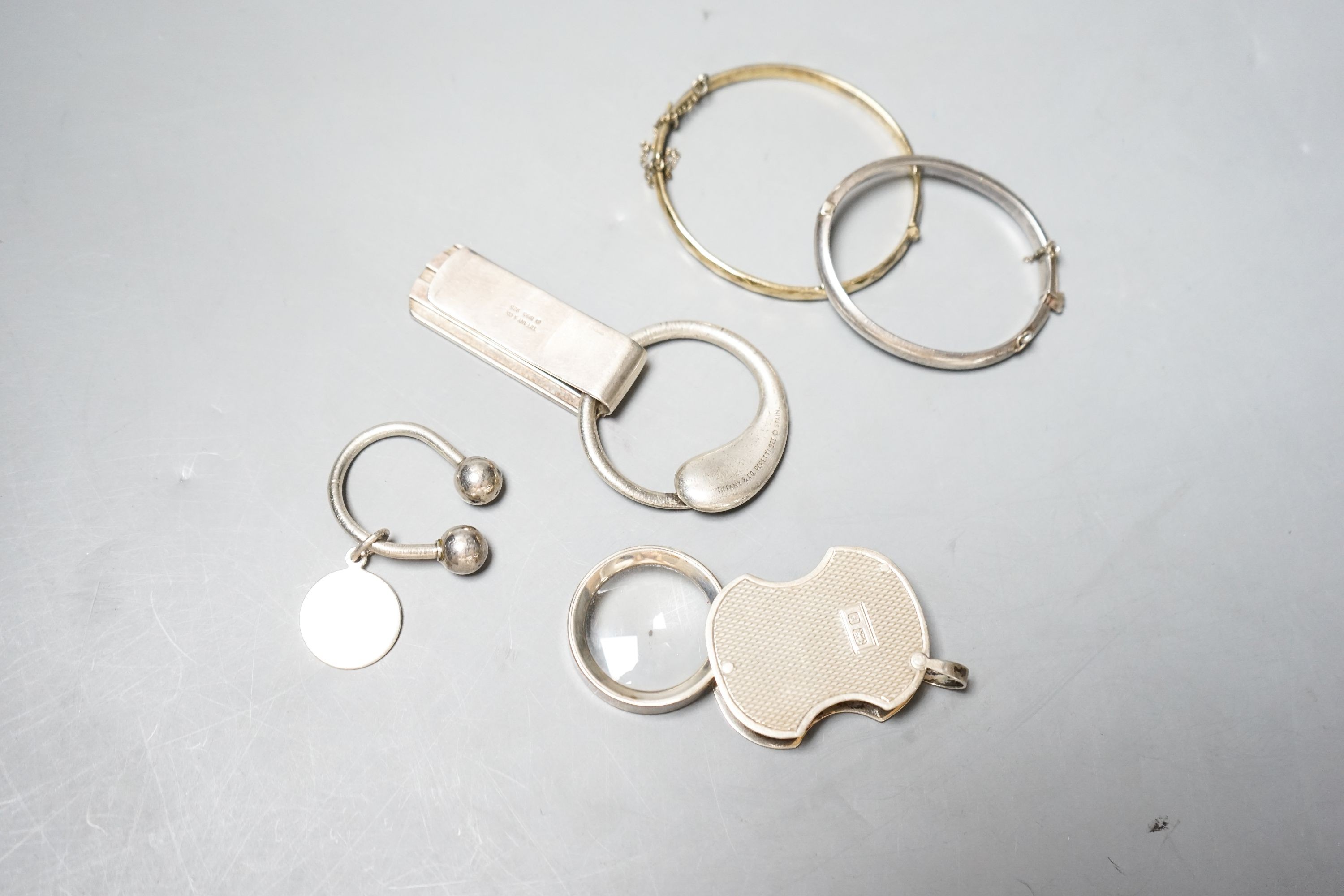 A modern silver mounted eye glass, a 925 Tiffany & Co sterling money clip and three other items.